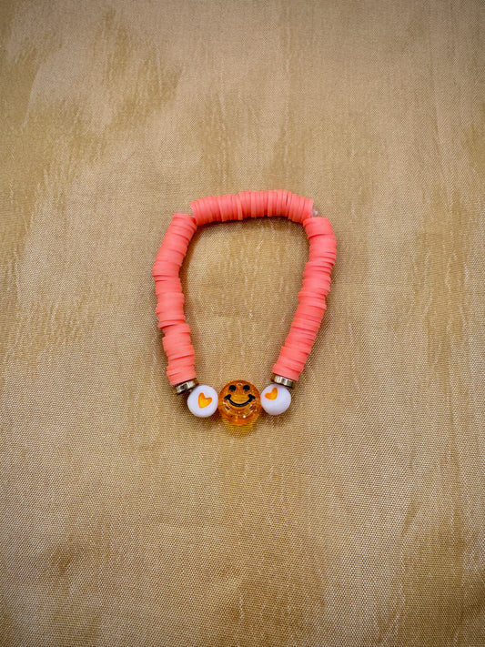 Orange smiley face bracelet