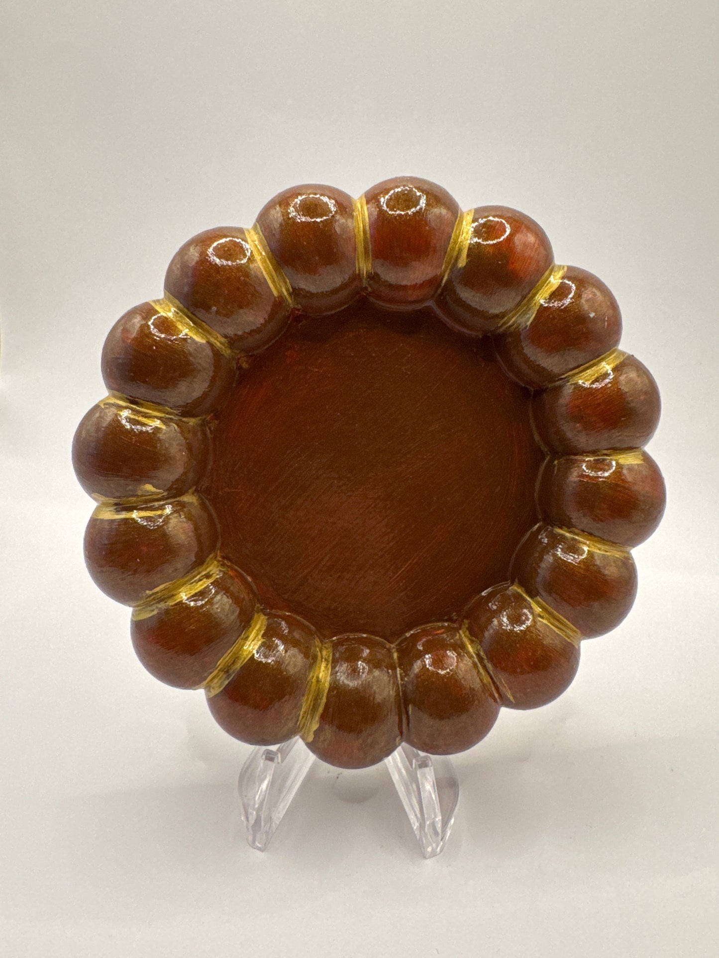 Brown and gold coaster