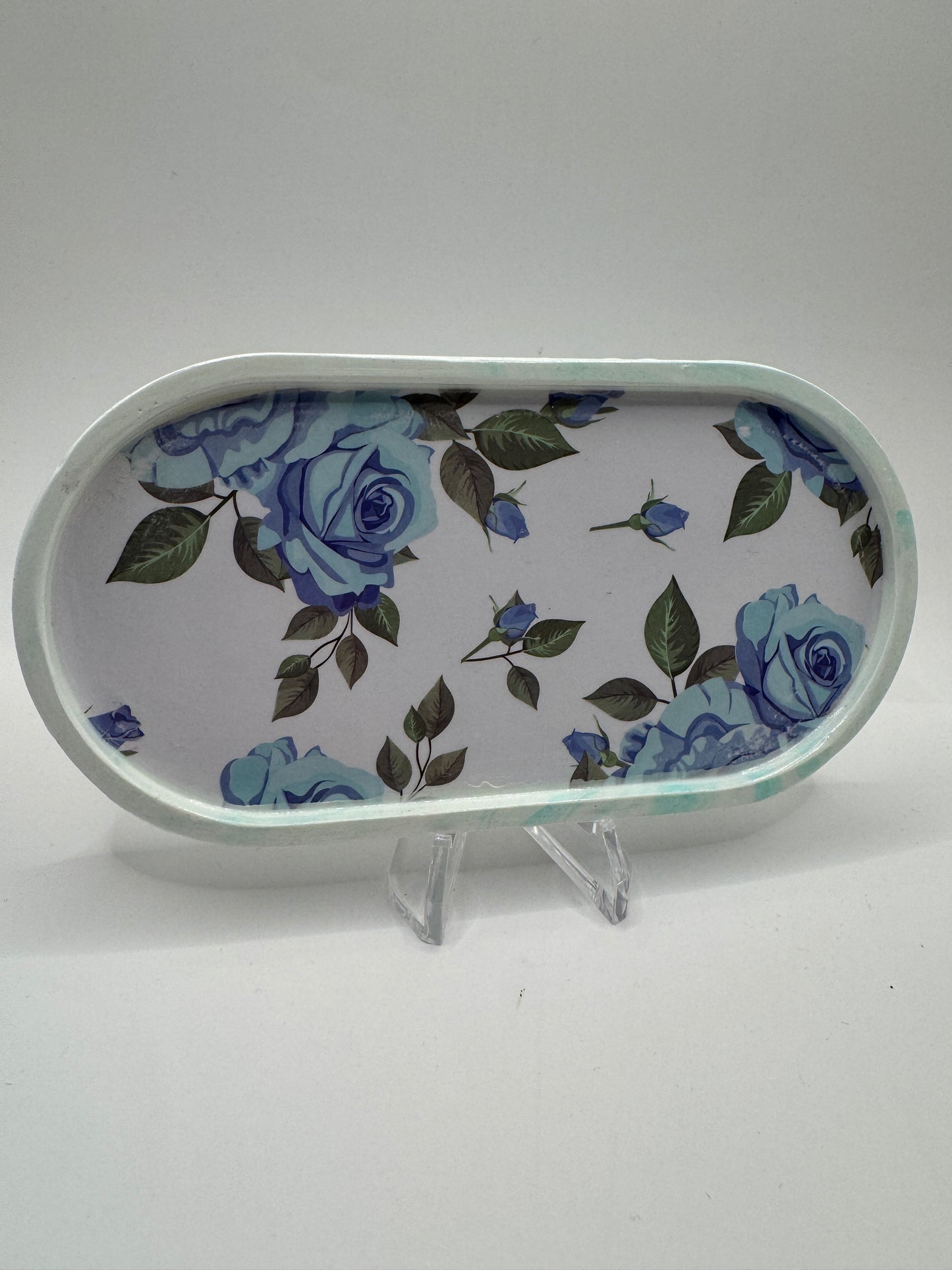 Blue flower with green leaves coaster